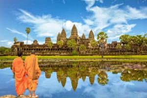 2 Monks in Cambodia looking at the temple of Angkor Wat in Siem Reap, Cambodia