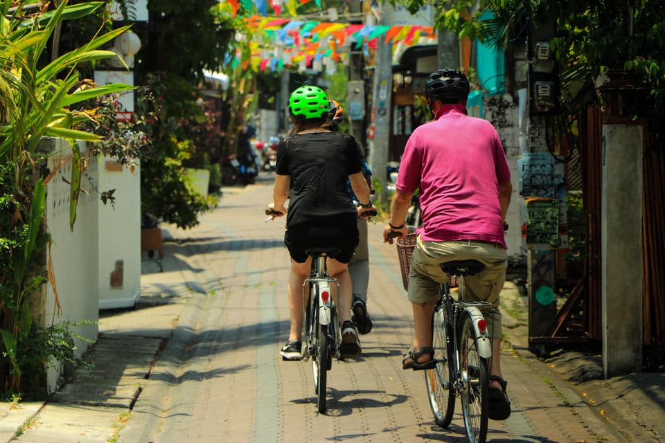 Tourist biking their way around in old town Chiang Mai
