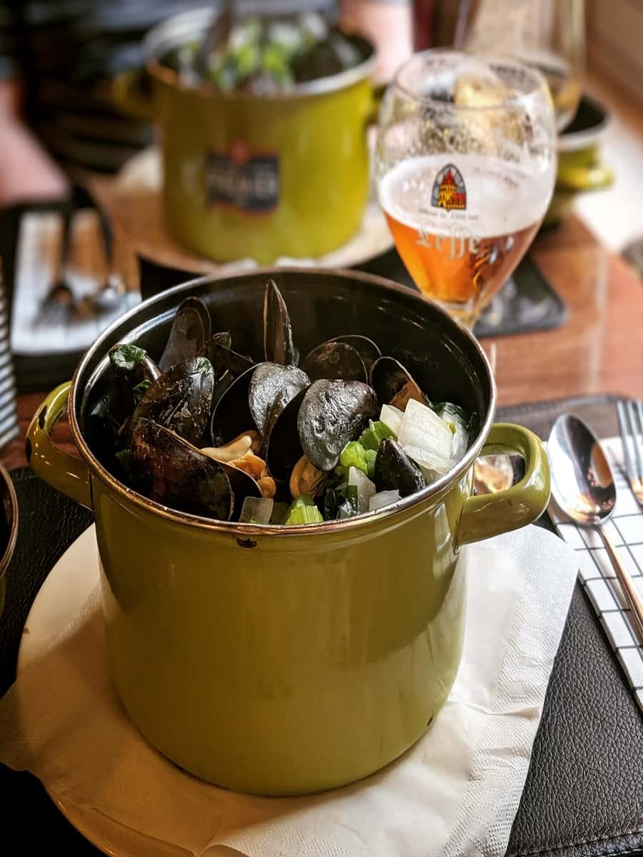Mussels in a pot at a restaurant.