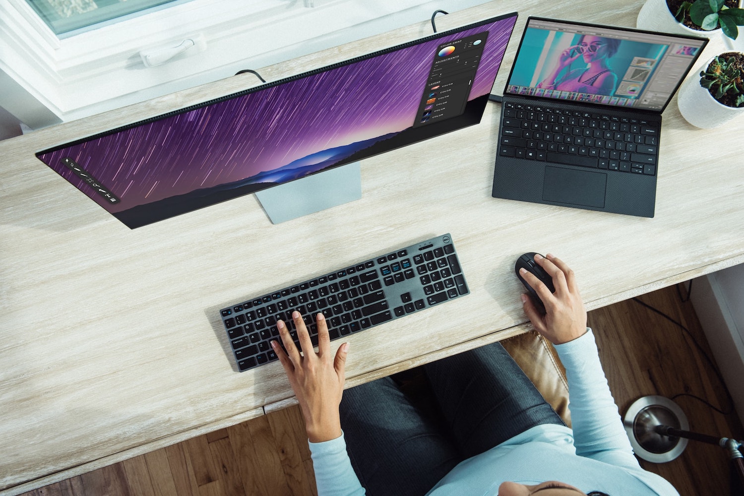 Person working on a laptop in a home office.