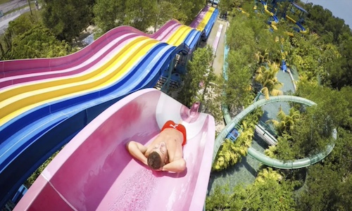 Man in a slide in a water park