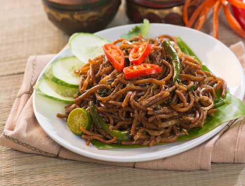Plate of Asian noodles with vegetables.