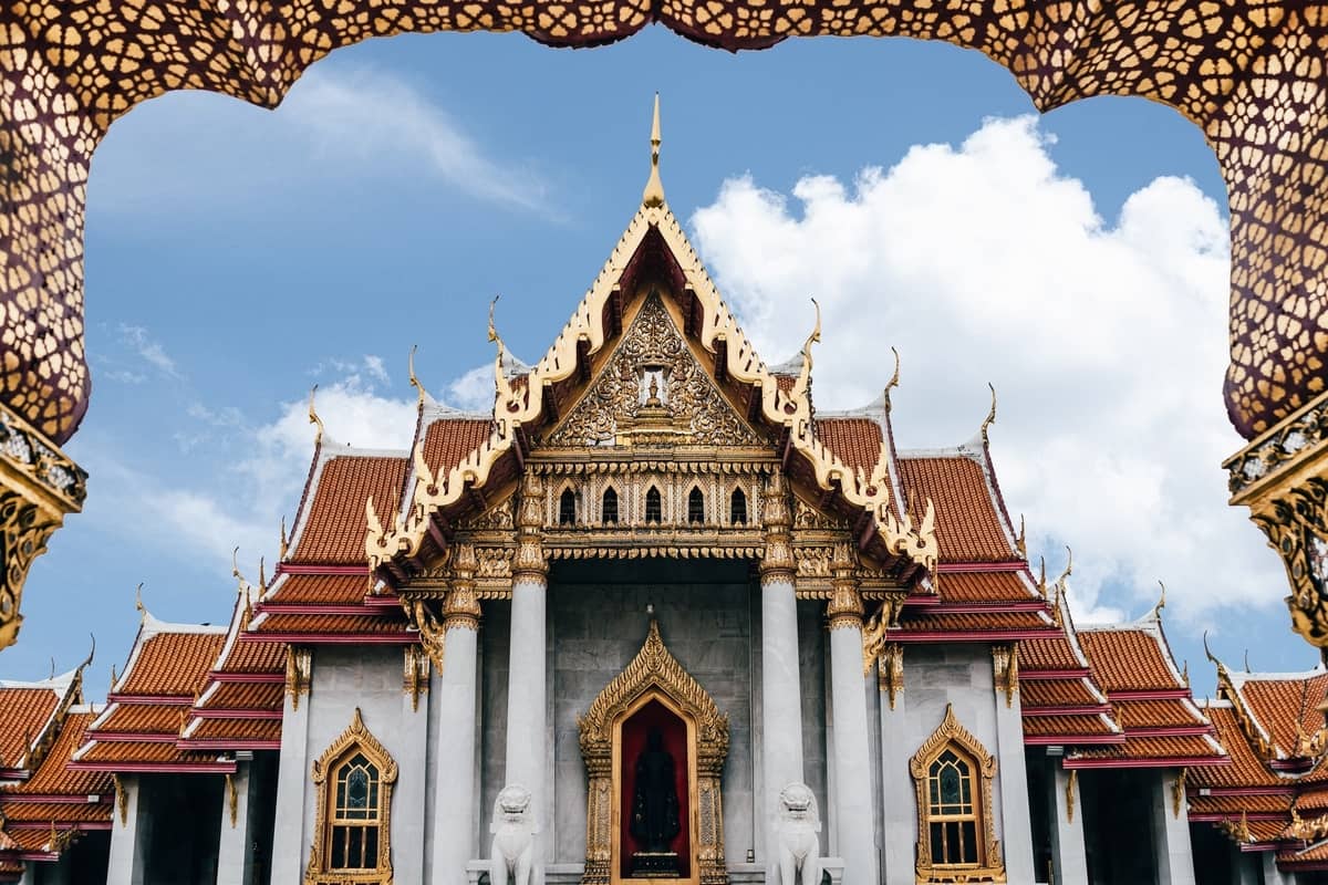 Ornate temple with gold and red accents. Thailand itinerary Bangkok temple