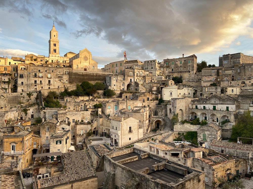 Wide view of Matera old city during the day with a beautiful blue cloudy sky