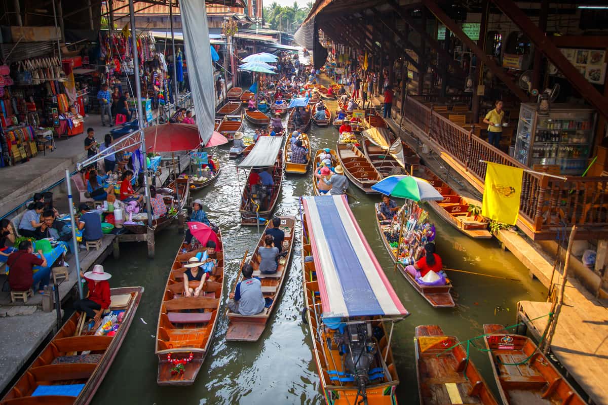 Bustling floating market with colorful stalls. Damnoen Saduak Floating Market
day trip Floating Market Bangkok