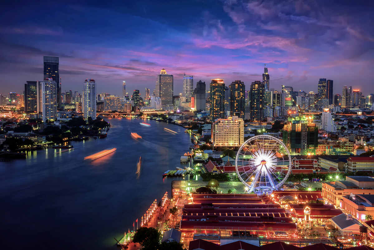 Lit-up cityscape with river in Bangkok. Things to do in Bangkok at night Bangkok skyline