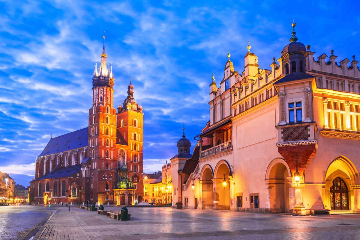 City square with historic buildings at night -  Best Things to Do at Night in Krakow