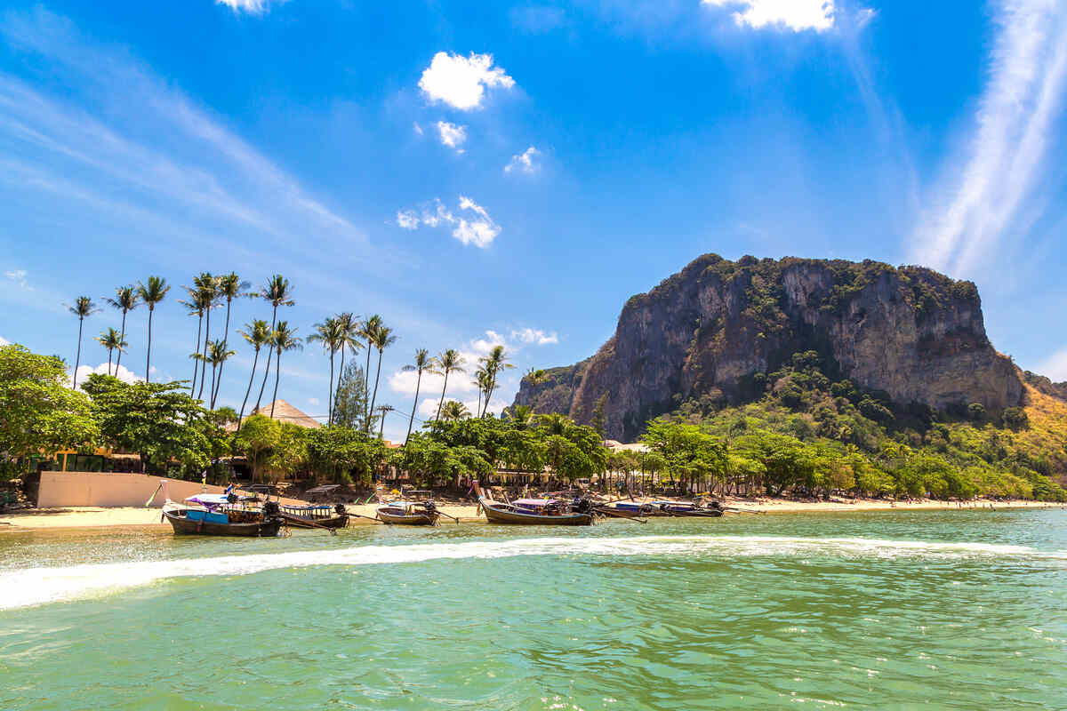 Beachfront with palm trees and a mountain backdrop. Things to do in Ao Nang Krabi