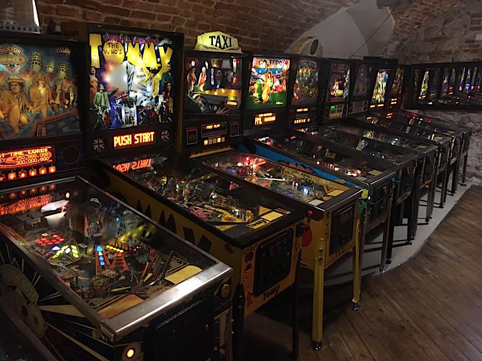 Vintage arcade room with pinball machines.