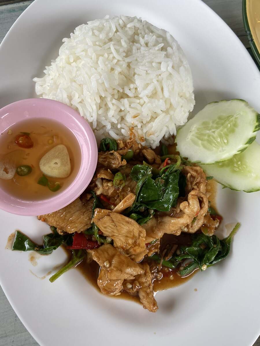 Plate of rice with spicy chicken and fish sauce