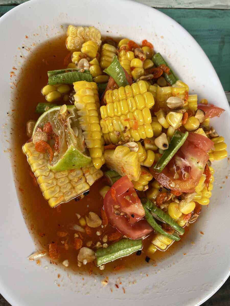 Spicy salad with corn and tomatoes.