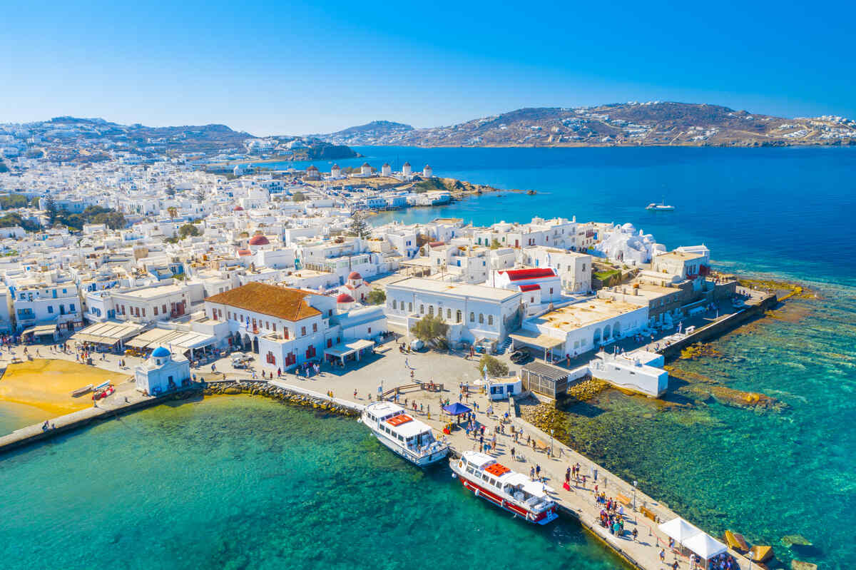 Aerial view of Mykonos and its white washed houses and mountainous background