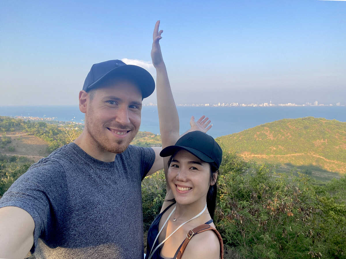 Couple posing with scenic ocean background. The Windmill Viewpoint at Koh Larn
