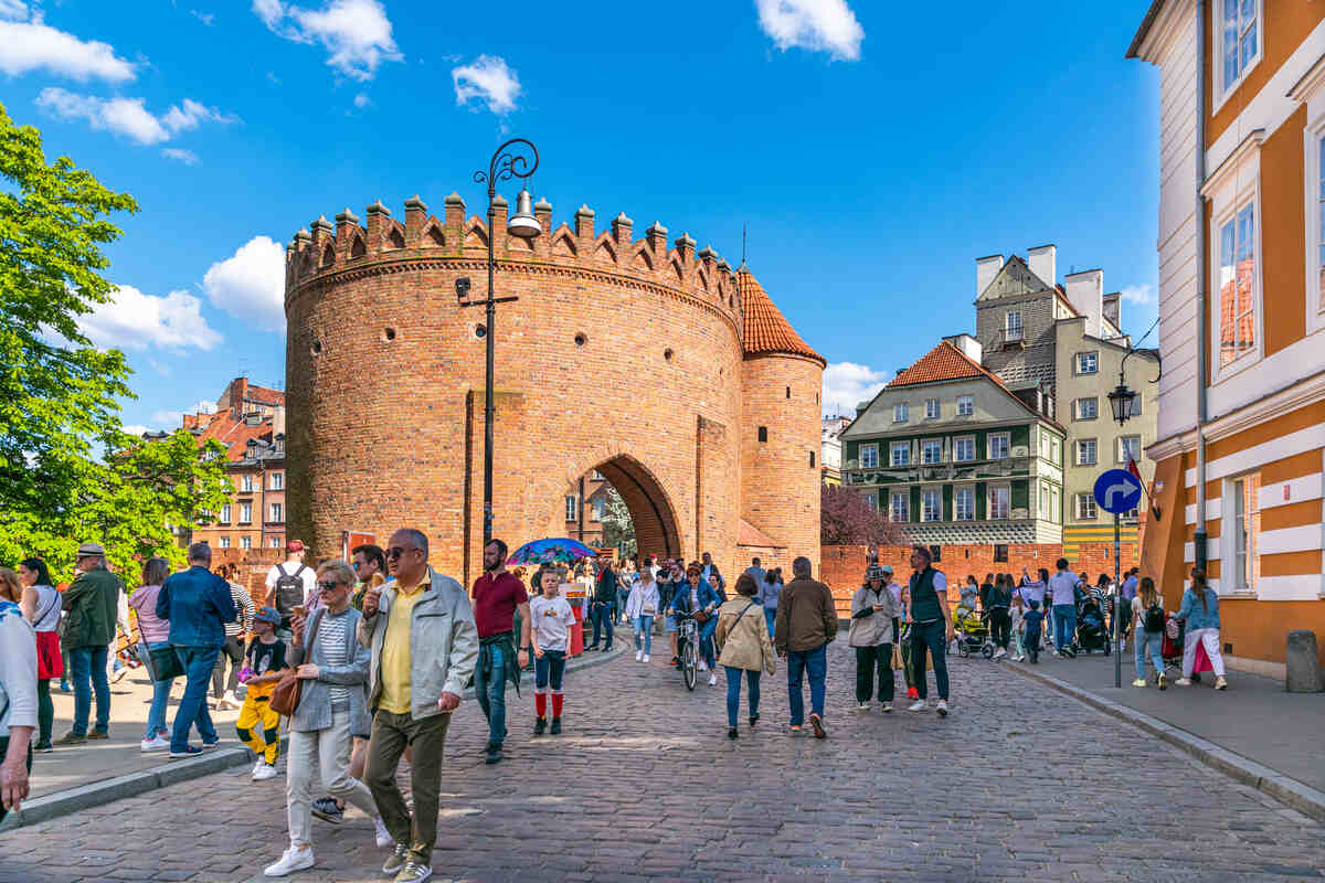 Walk on Warsaw Royal Route - A bustling city square with people, cobblestone streets, and historic architecture.