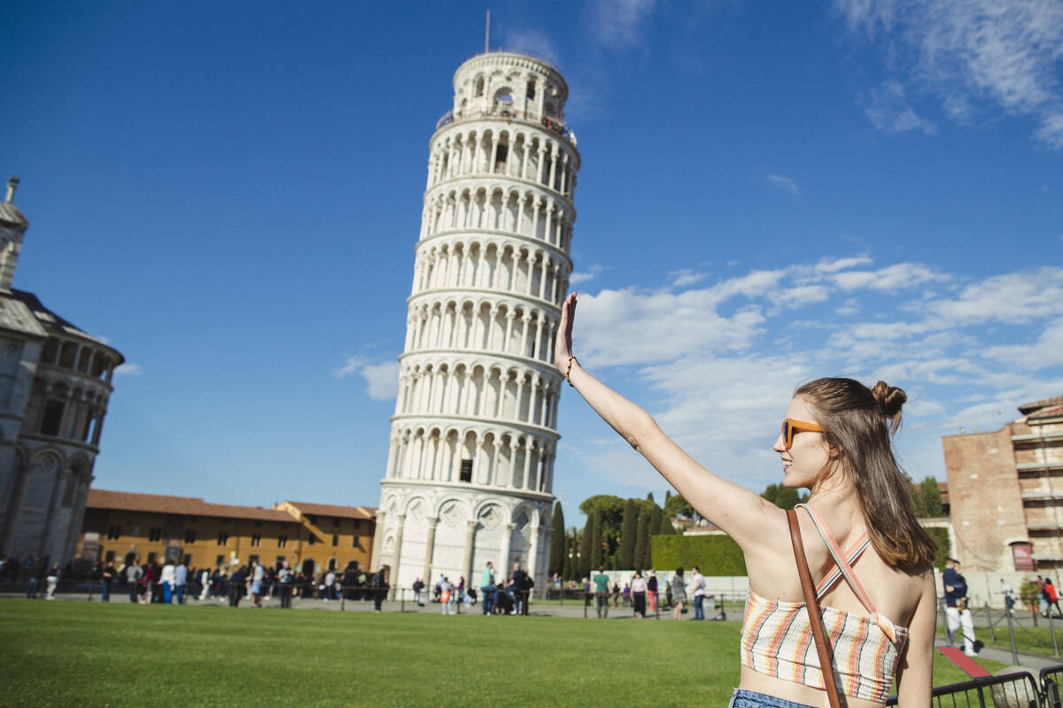 funny poses at Pisa leaning tower