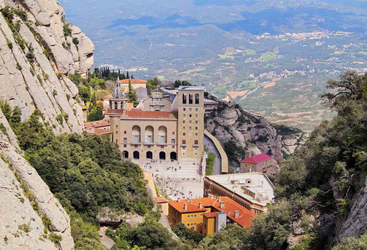 Monastery nestled in mountain cliffs. Montserrat Monastery Visit