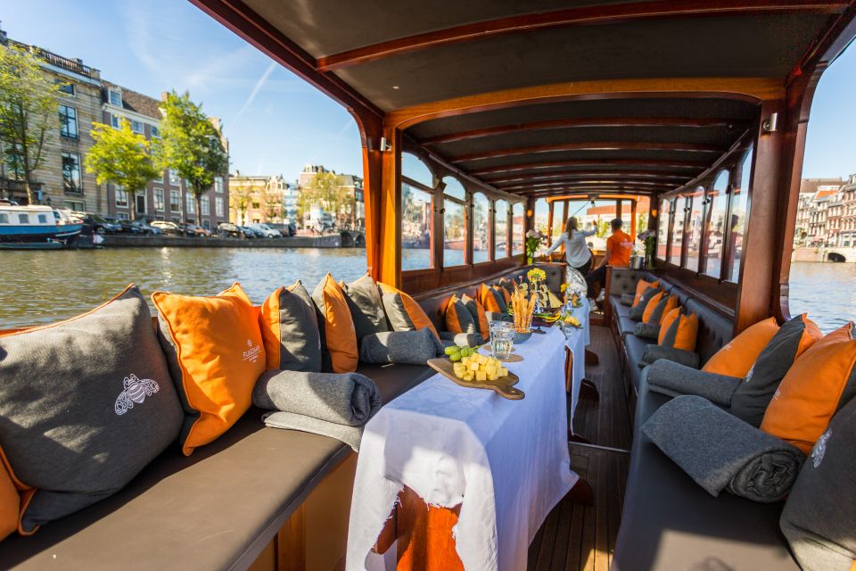 Comfortable boat interior with a city view.