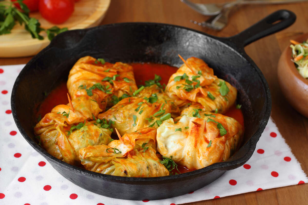 Cabbage in a pan with tomato sauce.