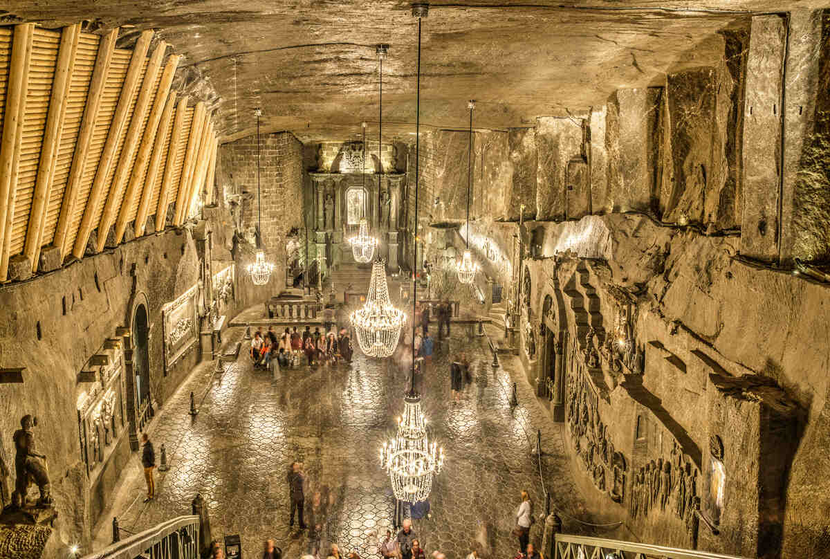 Cavernous underground salt mine with chandeliers.