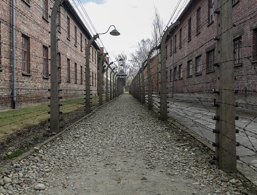 Cobblestone path between old buildings at Auschwitz concentration camp