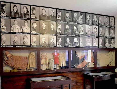 Wall of photographs in Auschwitz