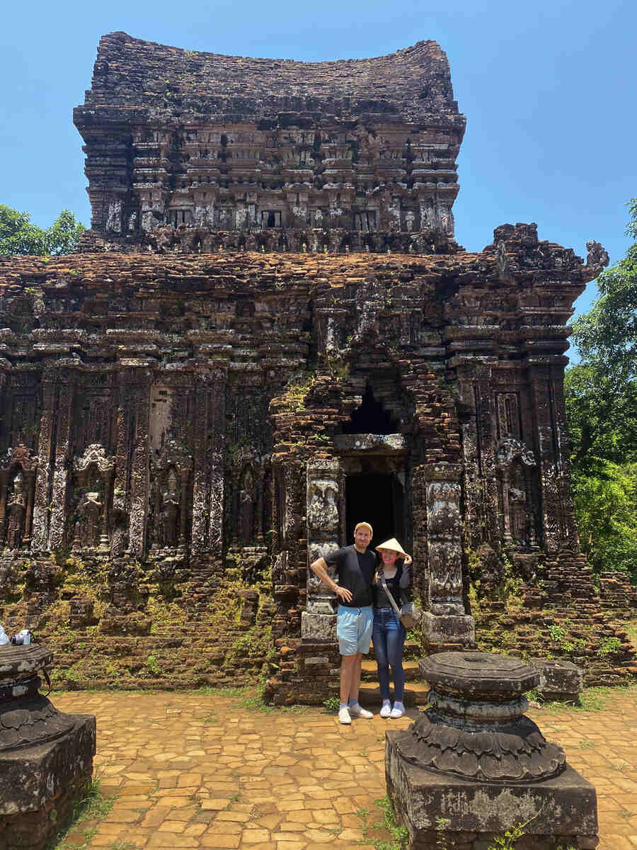 Tourists at a historic temple ruin.