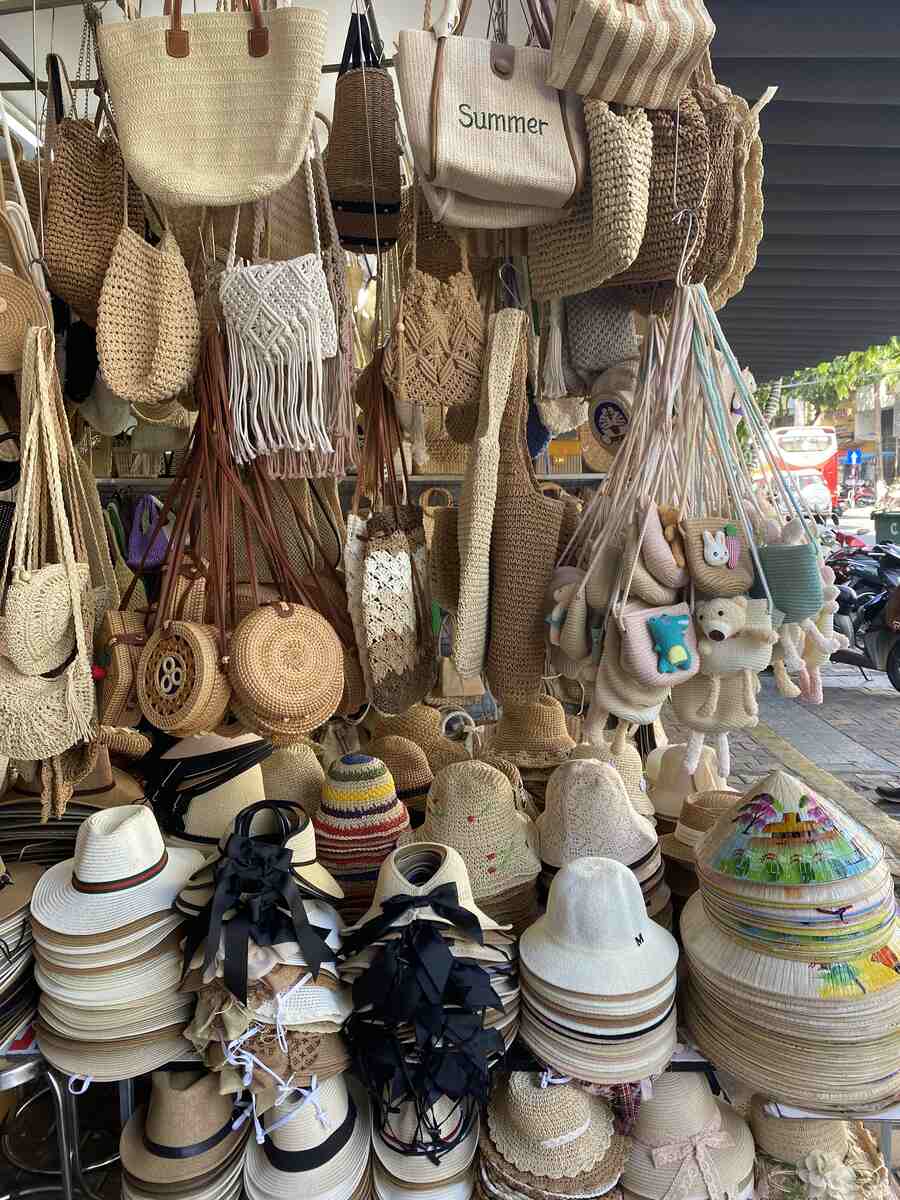 Stall with an assortment of straw hats.