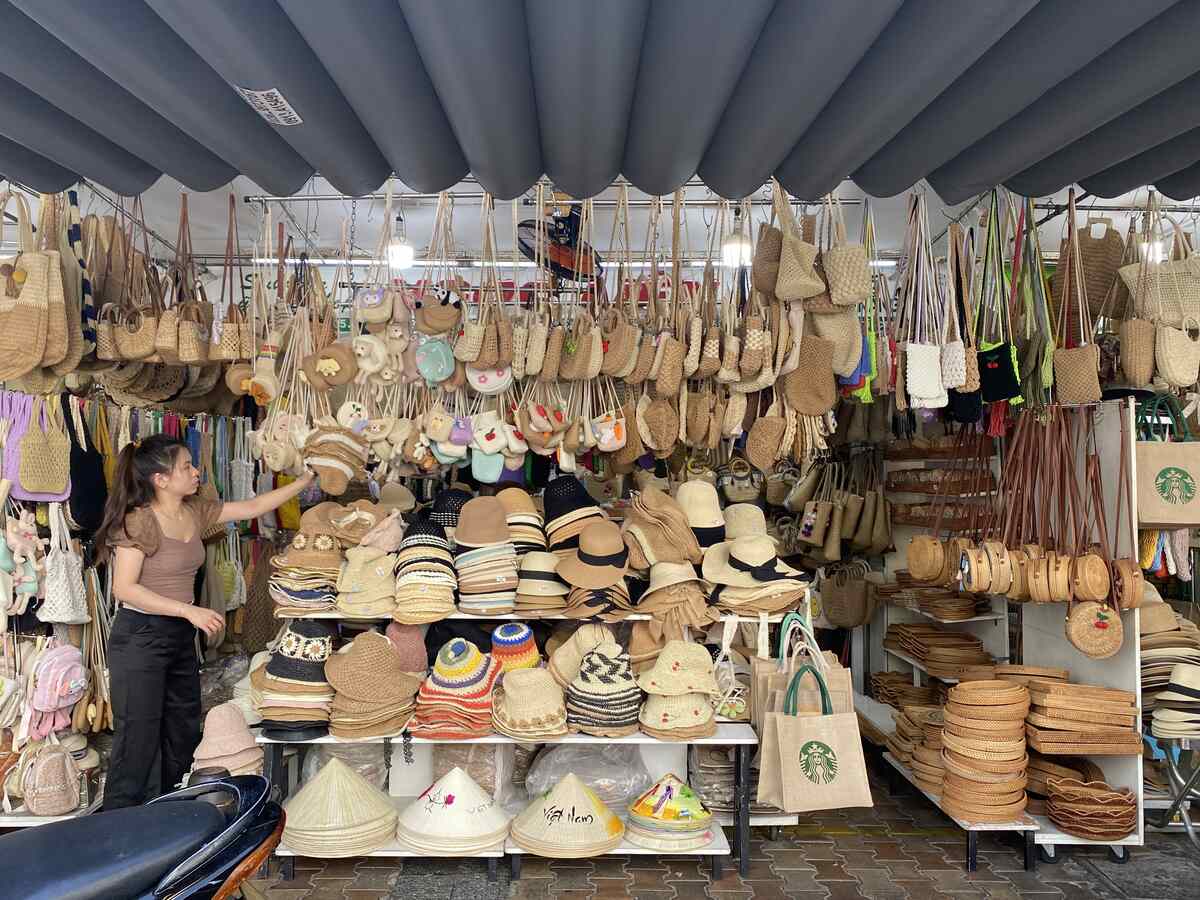 Market stall with wooden crafts and souvenirs.