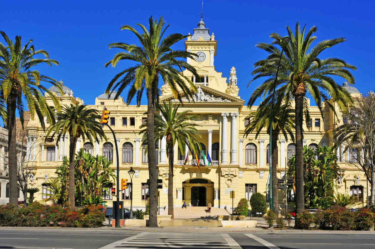 Ornate building with palm trees.