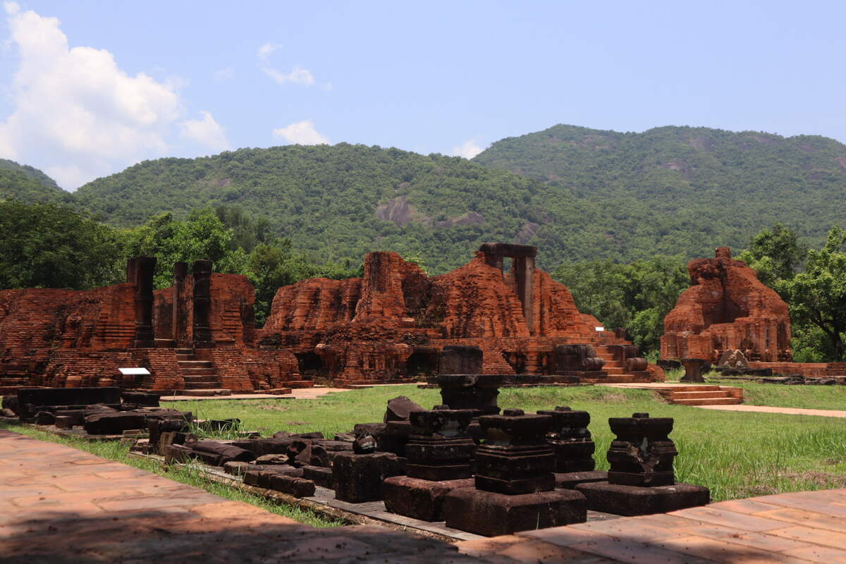 Temple complex with red brick ruins and steps. My-Son-Sanctuary-ruins