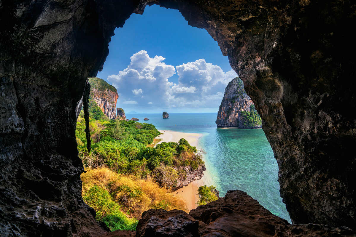 View of a beach through a cave. Plan the BEST 3 Days in Krabi Itinerary