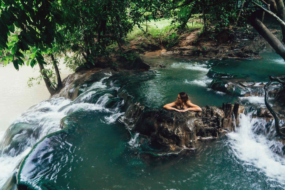 Natural pool with rocks and waterfall. Relax-in-the-Krabi-Hot-Springs
