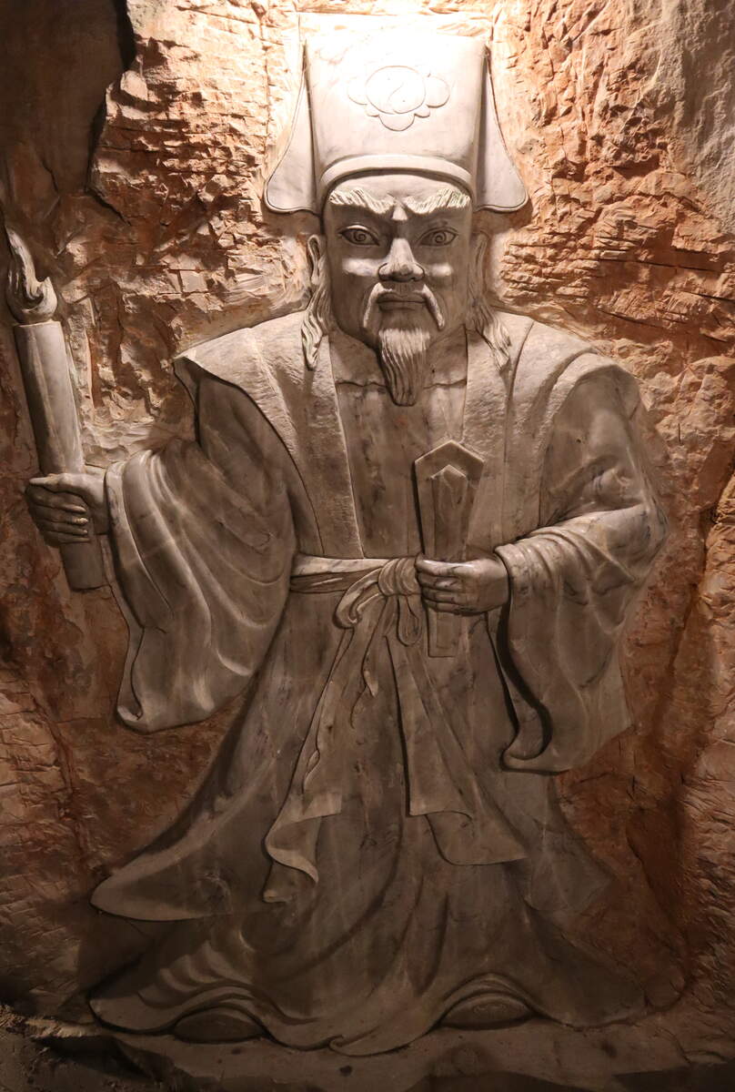 Traditional Buddhist statue inside a cave at the Marble Mountains in Da Nang