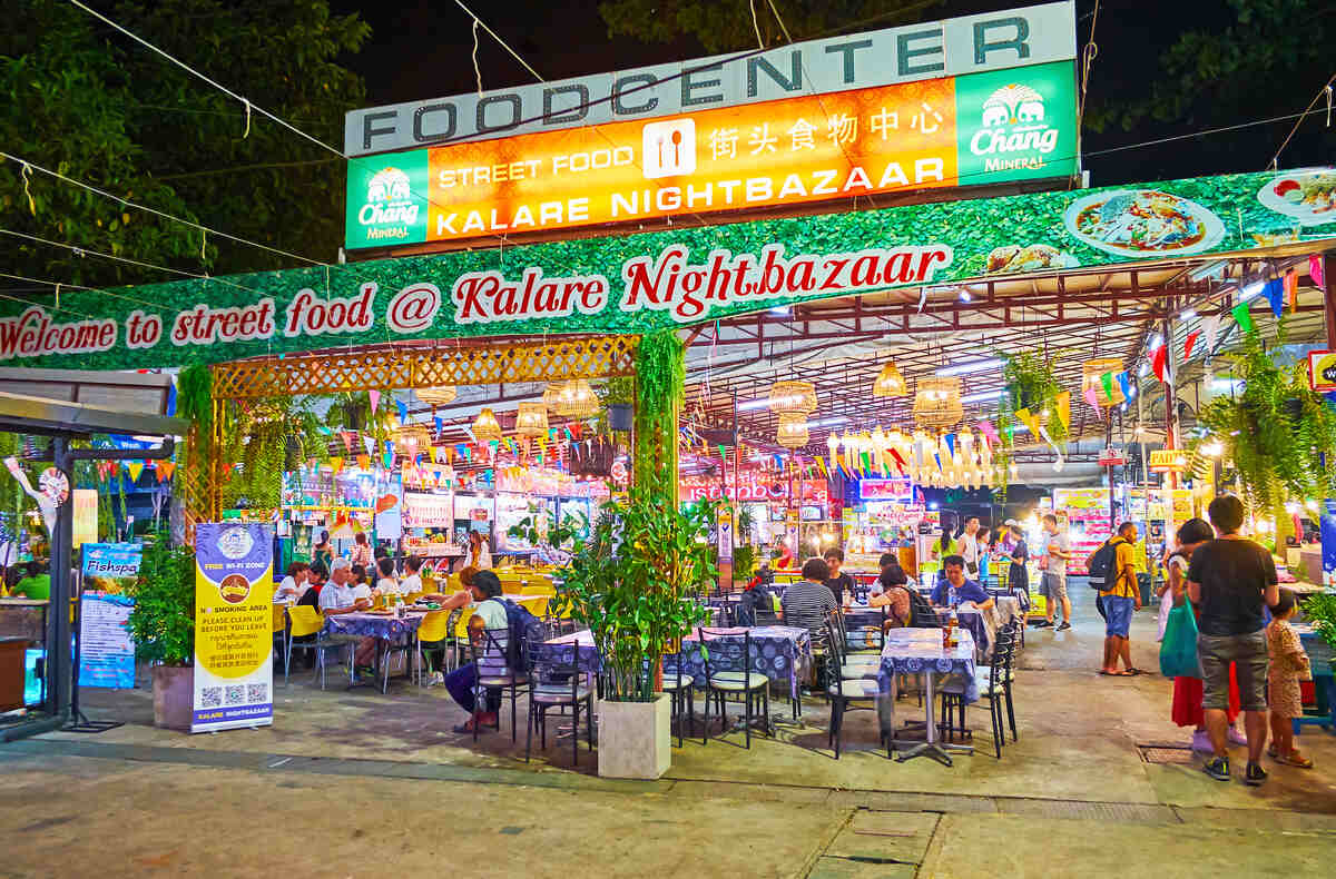 Night market entrance with colorful lights.