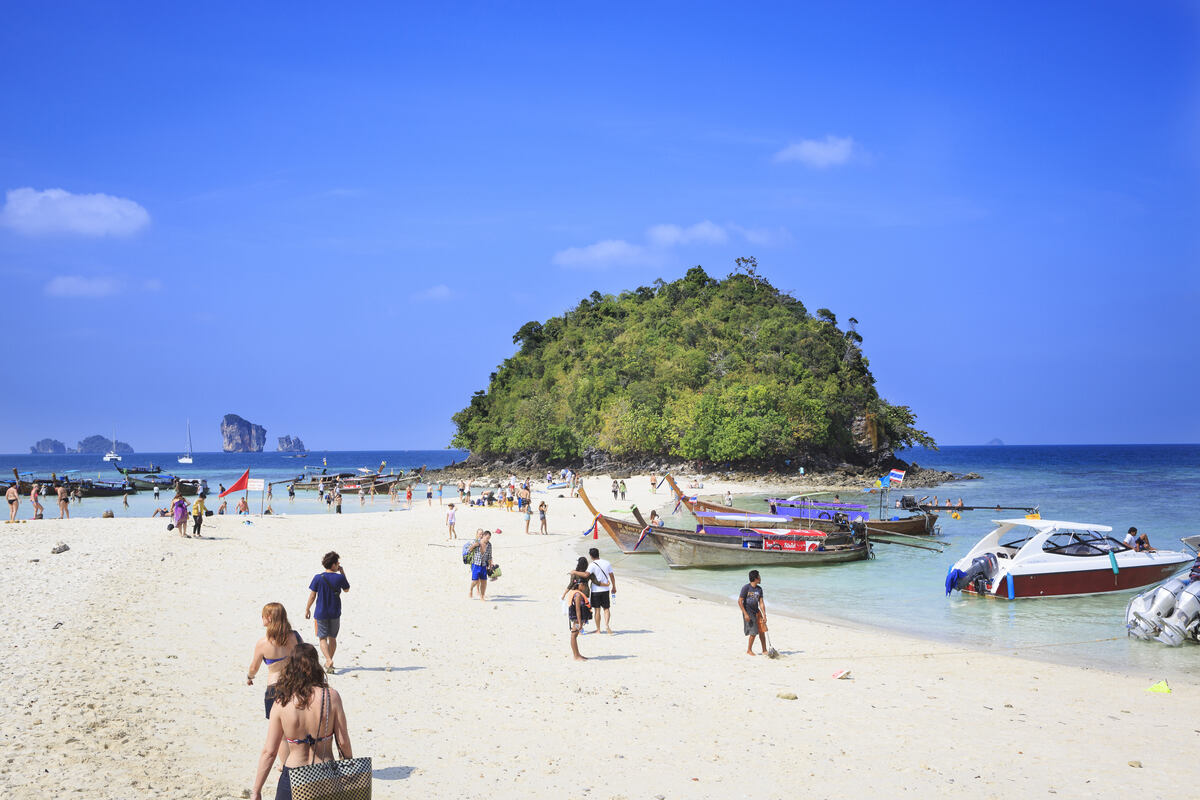 Tourists sunbathing on a tropical beach. Tup Island 7 island tour Krabi