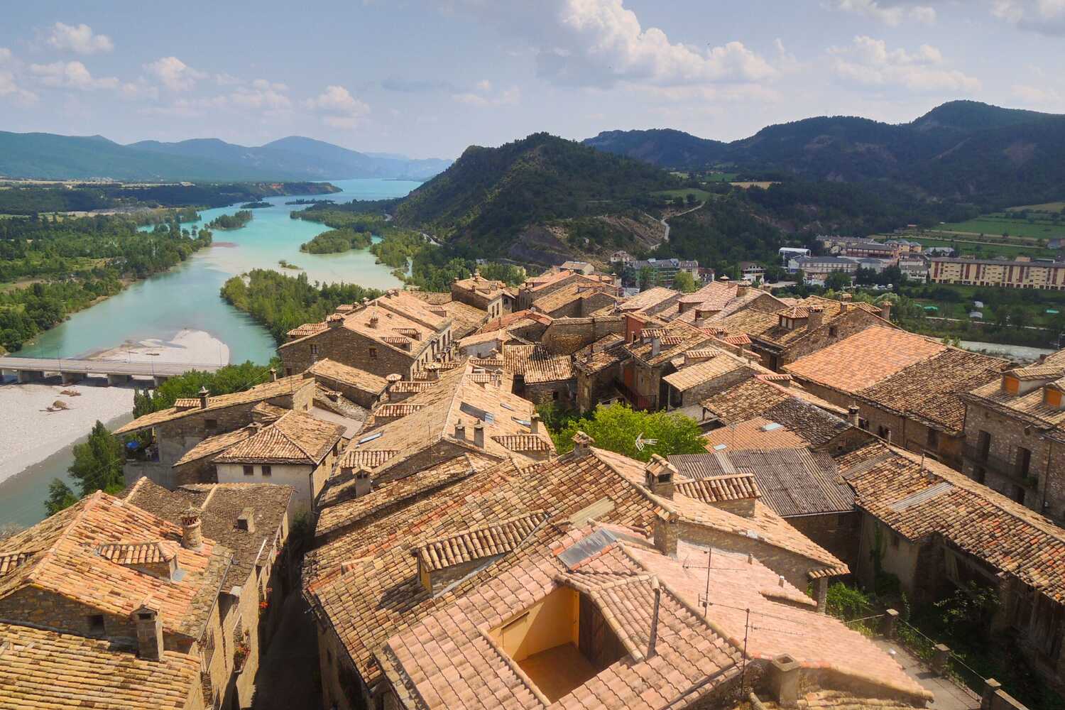 Aerial view of Ainsa Aragon with historical buildings and a river