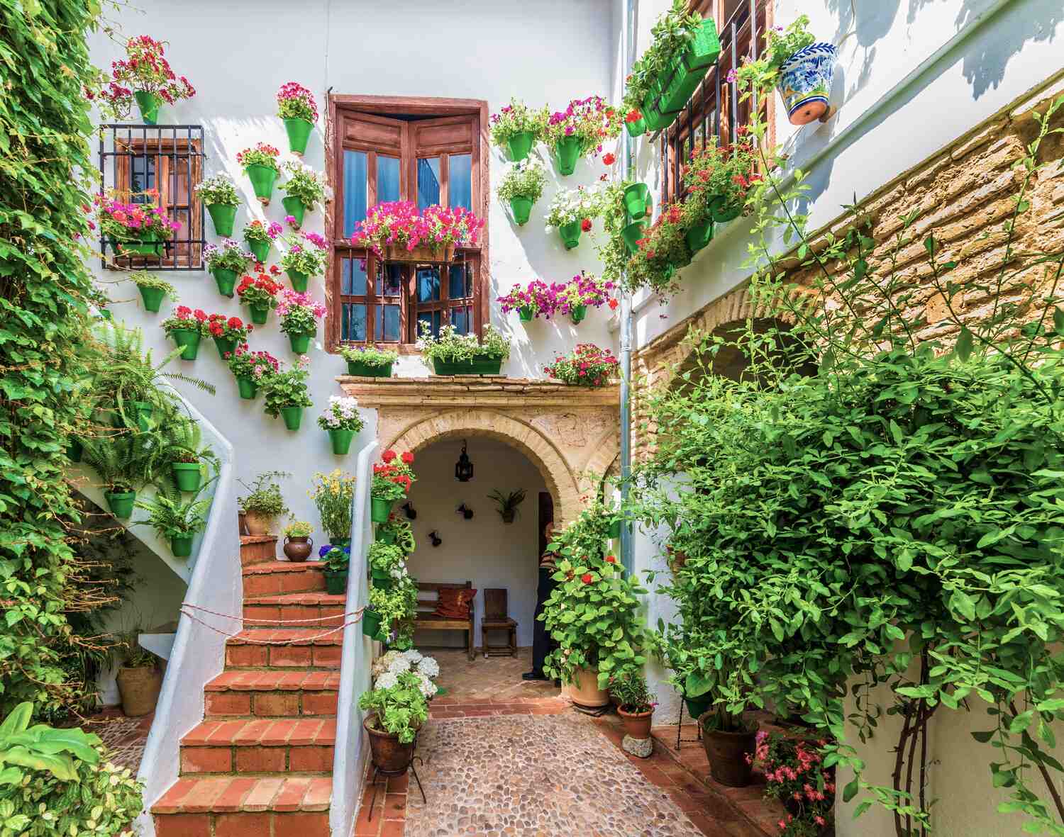 Alleys in Cordoba with flower pots and stairs