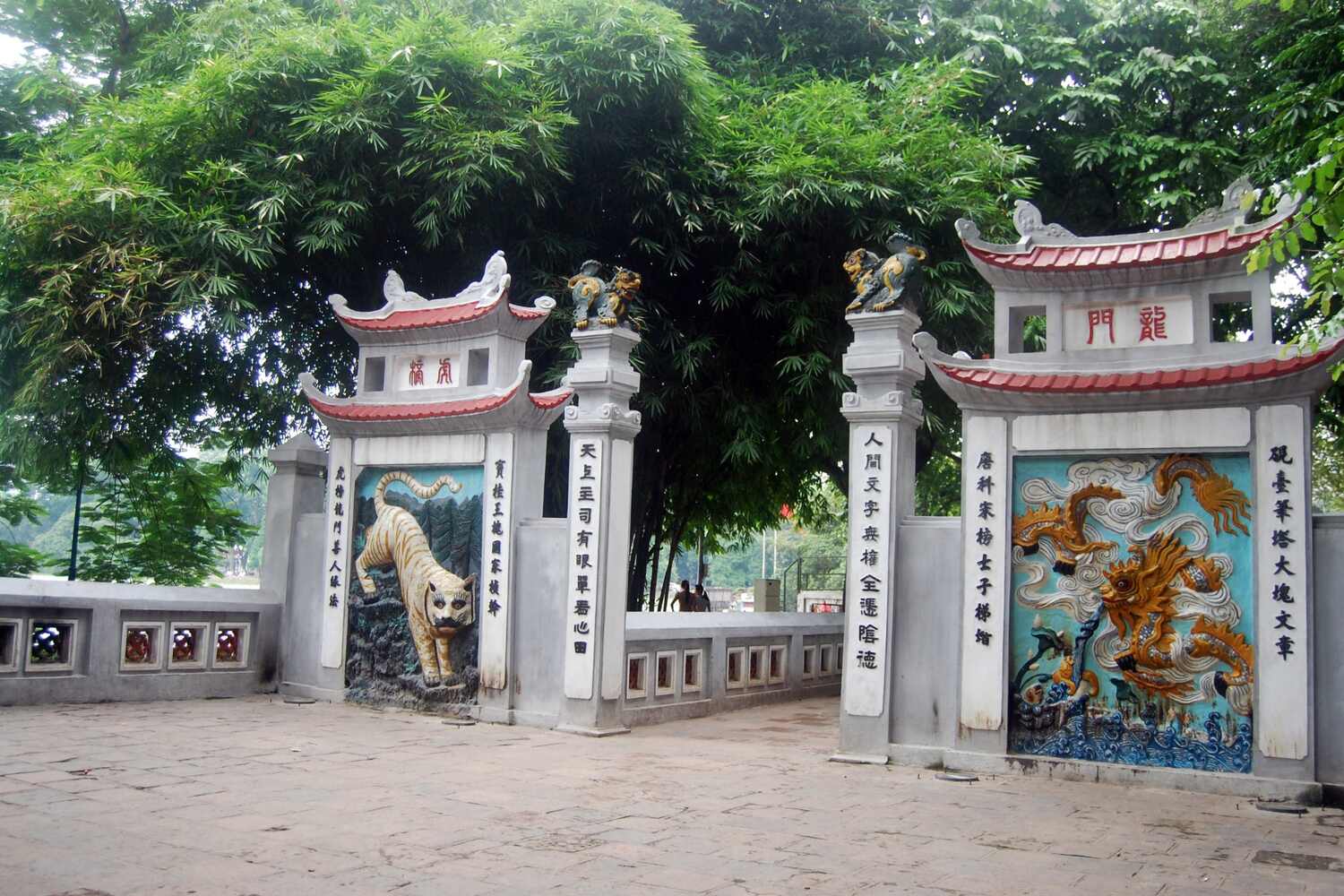 Street view of an ancient Asian temple with intricate carvings and historical architecture