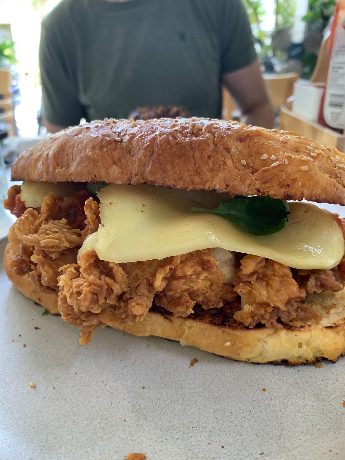 Jeremy Kitchen fried chicken sandwich on a bun