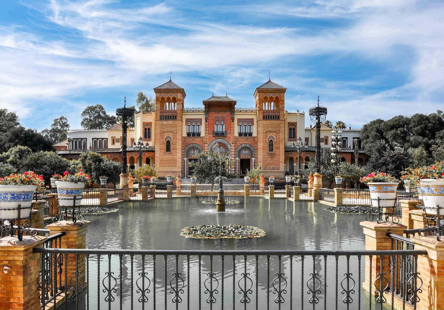 Parque de Maria Luisa in Seville with a fountain and historical building
