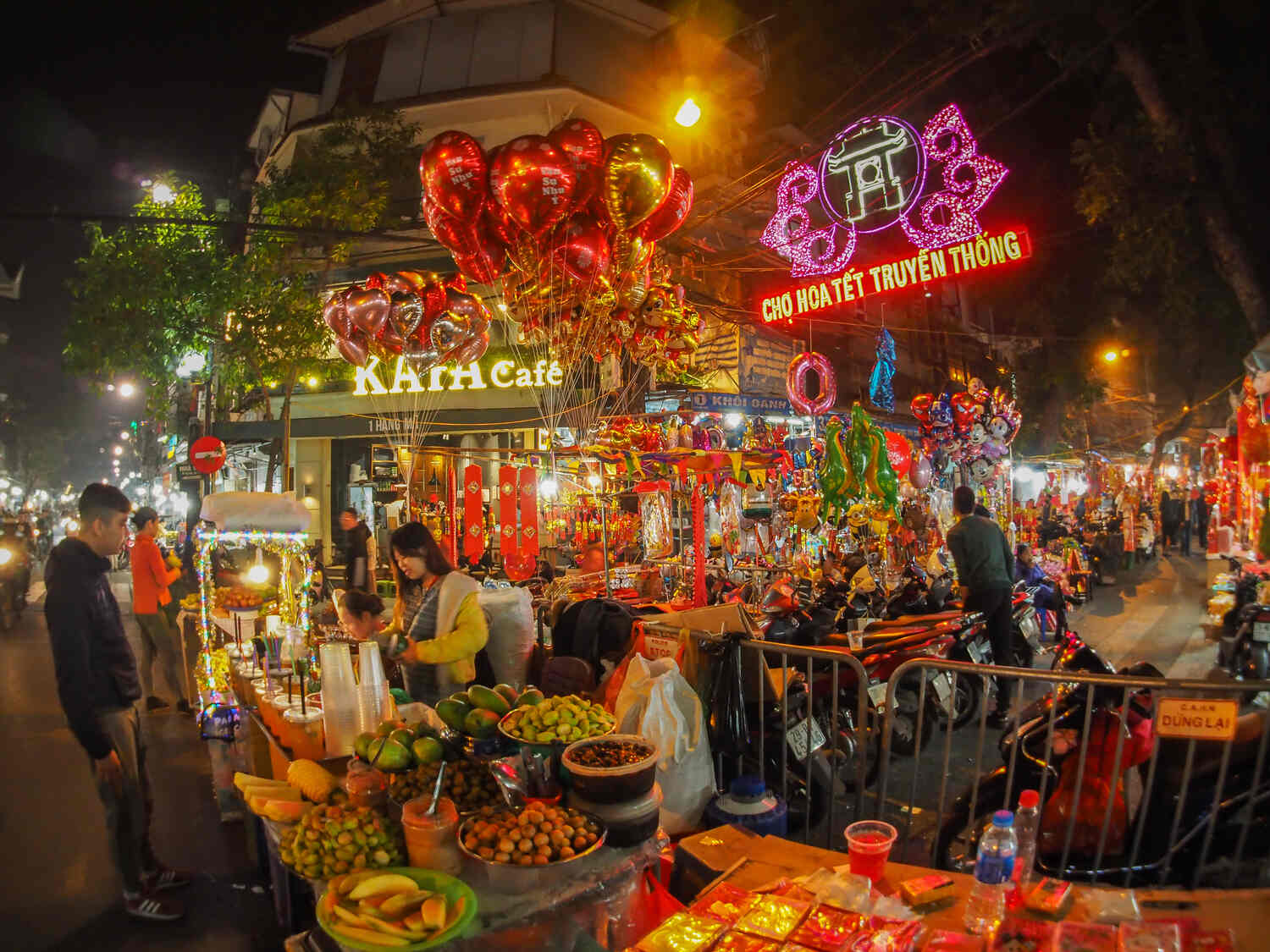 Lively street food market with colorful stalls and vibrant night atmosphere
