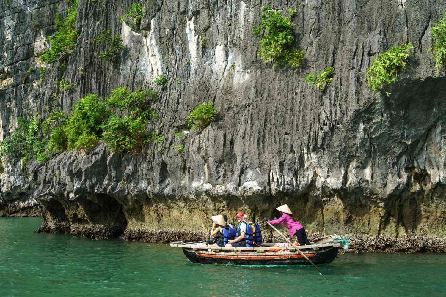 Boat tour exploring a waterway through a dramatic limestone cave.