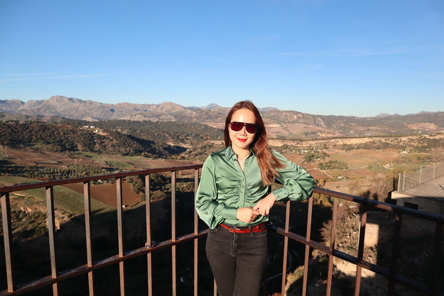 Woman posing with views at Alameda del Tajo Park