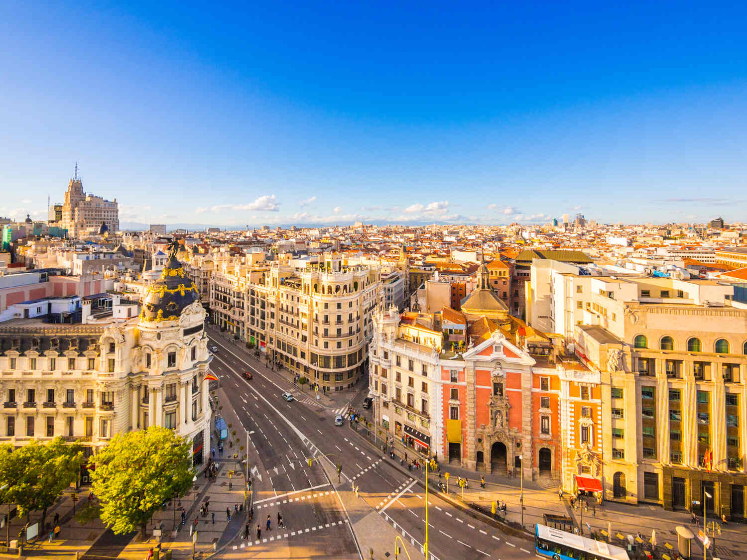 Expansive view of Madrid's city center with iconic buildings and bustling streets.