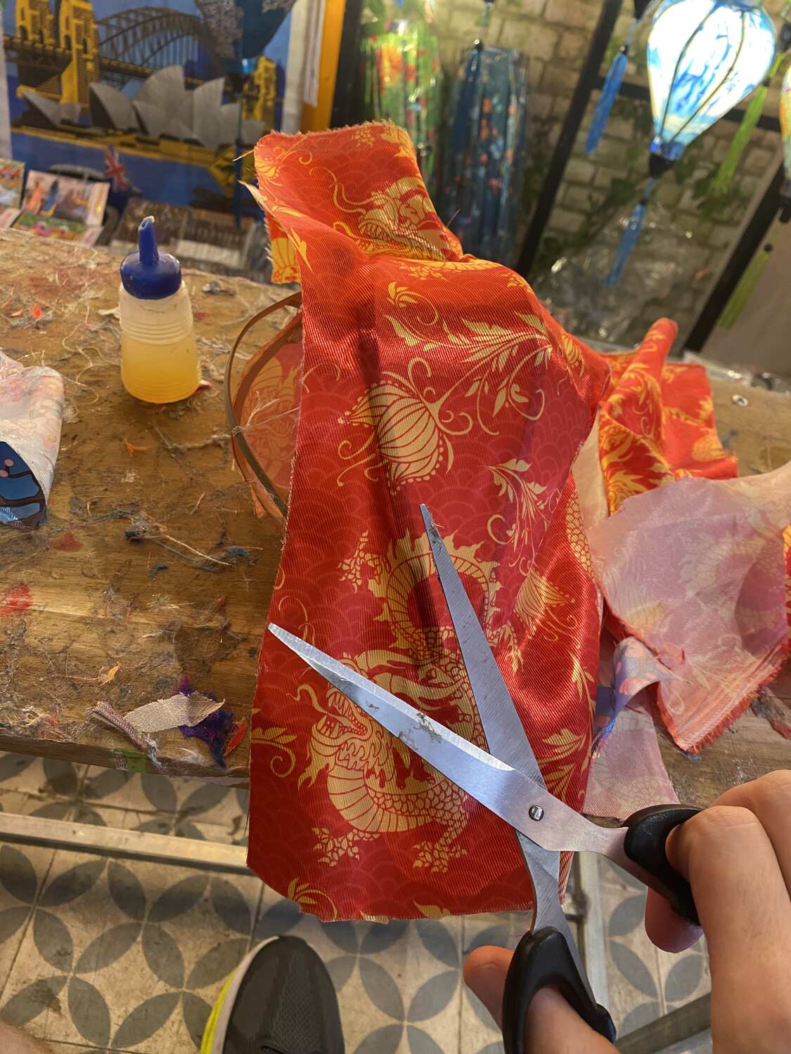 Cutting the silk at a lantern making class Hoi An