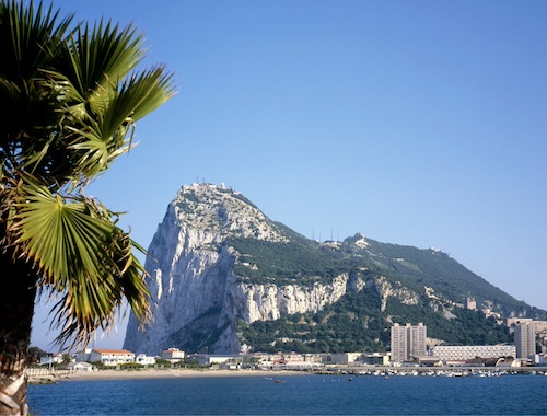 Gibraltar Rock behind palm trees