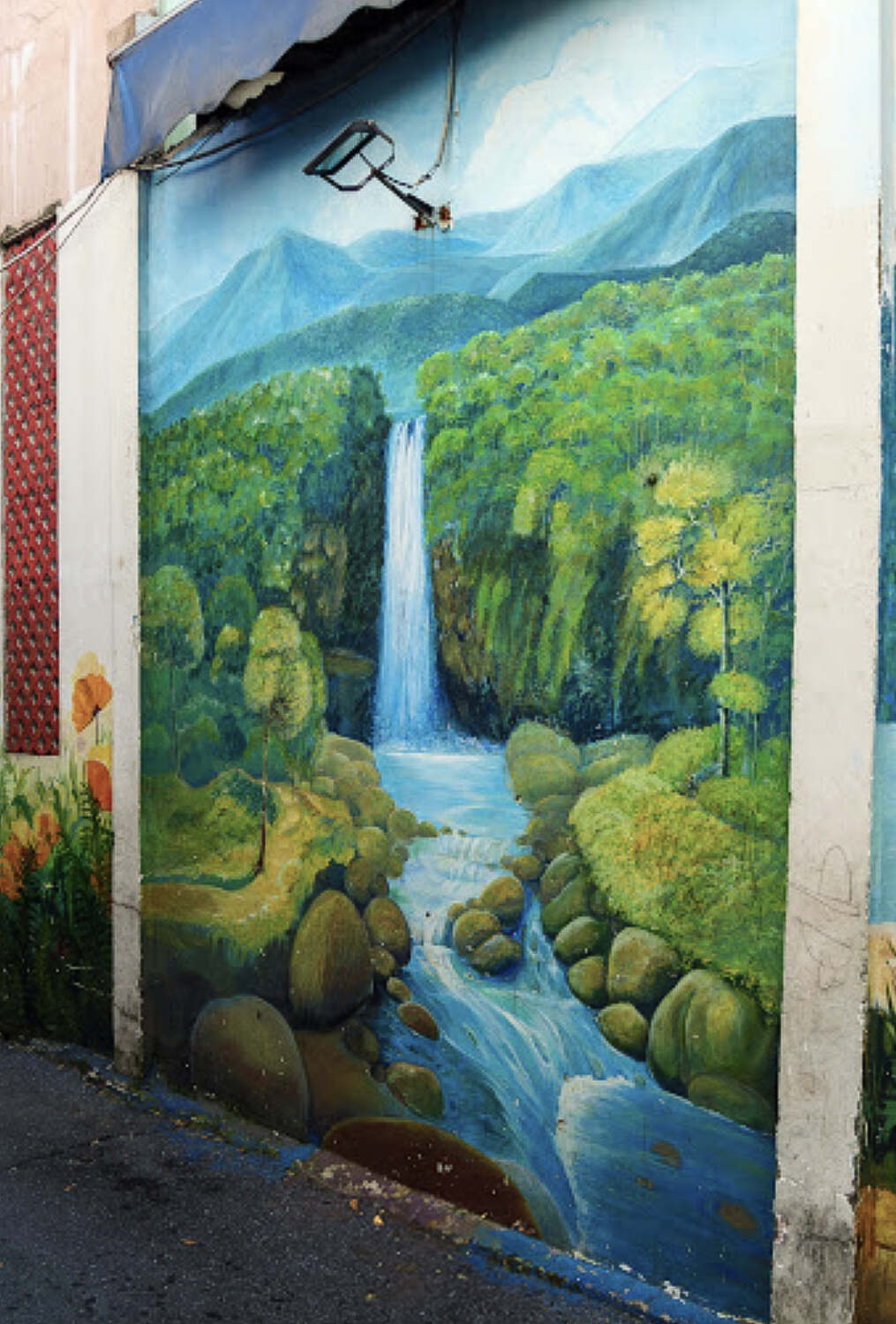 Waterfall and jungle graffiti at Da Nang Fresco Village