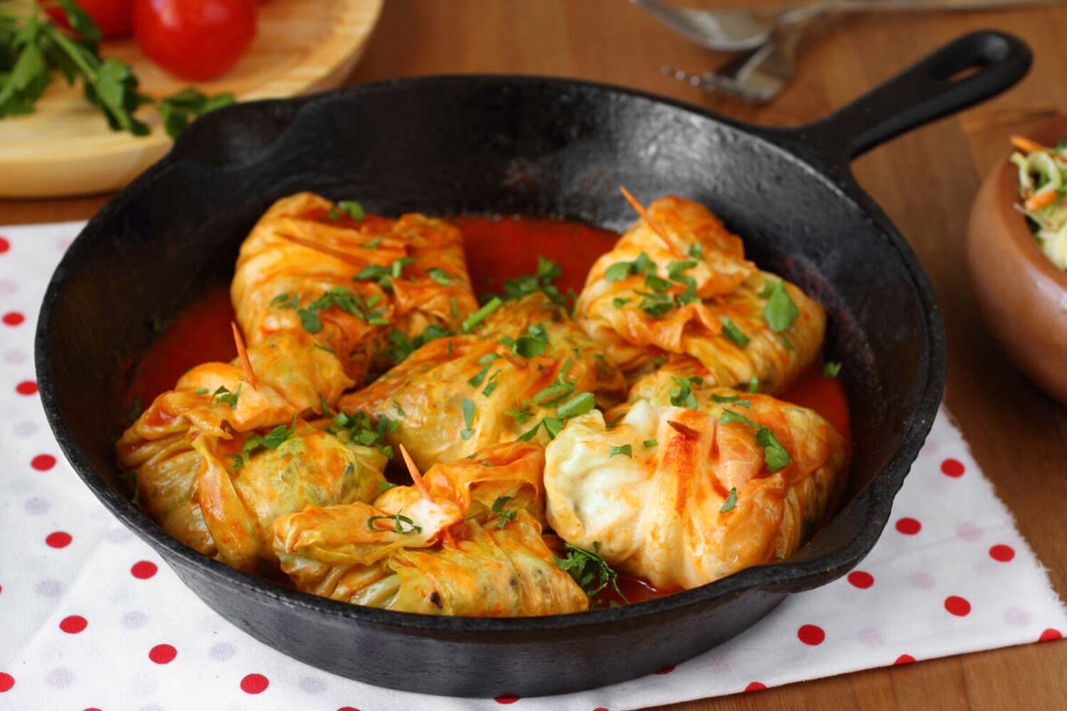 Cabbage in a pan with tomato sauce.