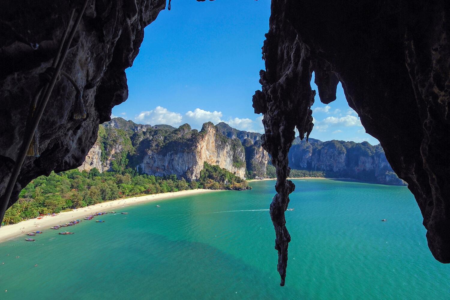 View of a beach through a cave. Plan the BEST 3 Days in Krabi Itinerary